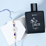 Ivory Flower Evil Eye Rakhi & UXR Royal Life Perfume Gift Set