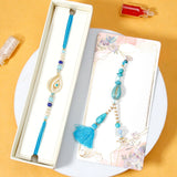 Golden Eye & Turquoise Drop Tassel Rakhi Set