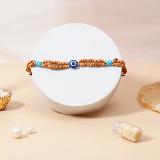 Wooden Evil Eye Beaded Rakhi & UXR Classic Oud Perfume Mug Set