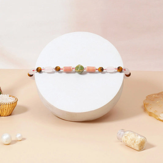 Rose Quartz Tiger Eye Beaded Rakhi & UXR Classic Oud Perfume Mug Set