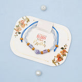 Crystal Swan Charm & Lavender Ceramic Bead Rakhi Set