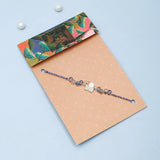 Crystal Swan Charm & Lavender Ceramic Bead Rakhi Set