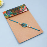 Teal Stone Medallion & Shell Tassel Rakhi Set