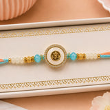 Peach and Blue Om Rakhi in Gold Finish For Brother