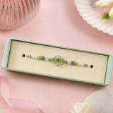 Traditional Green Stone Rakhi With Gems For Brother