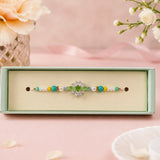 Traditional Green Stone Rakhi With Gems For Brother