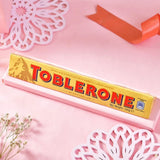 Delightful Bhai Rakhi Hamper with Besan Laddoo, Toblerone Chocolate & Almond Nuts