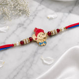 Designer Rakhi With Kaju Katli And Dry Fruits Hamper