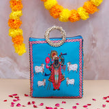 Vastu Kaamdhenu Cow with Gold Emblishment with Ethnic Handcrafted Bag with Chocolates
