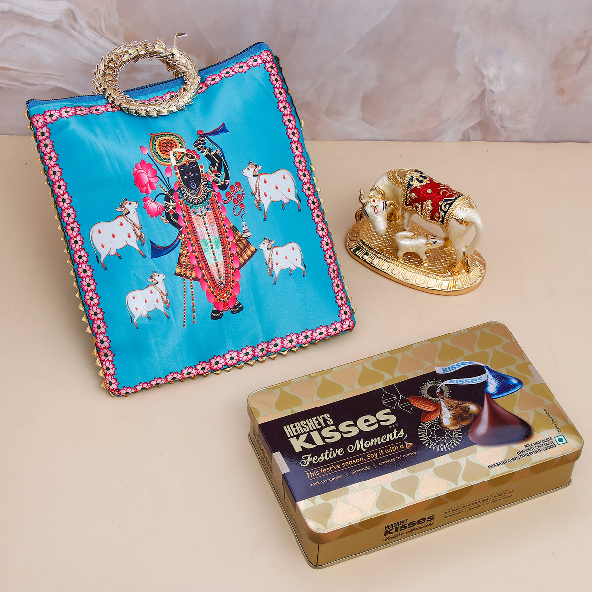 Vastu Kaamdhenu Cow with Gold Emblishment with Ethnic Handcrafted Bag with Chocolates