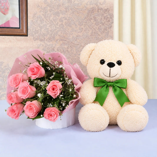 8 Pink Roses- Pink paper packing- 1 Pink Teddy Bear (10 inches)