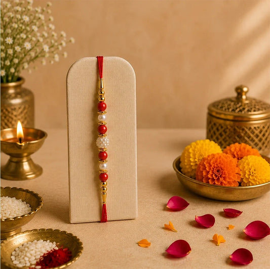 1 Pearl Rakhi With 5 Sunflowers & 6 Peach Roses Sea Green Bouquet