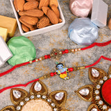 Antique and Krishna Rakhi with Almond and Chocolates Set of 2