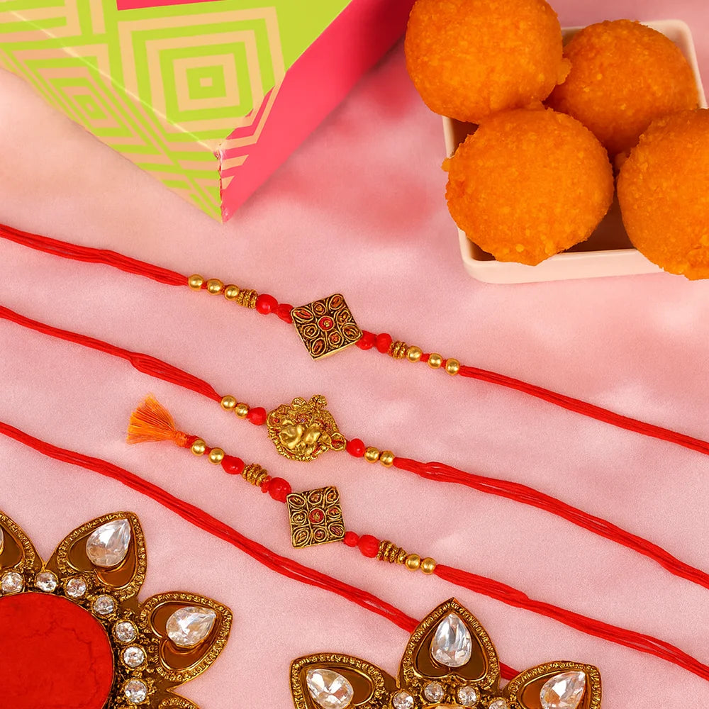Kundan and Ganesha Rakhi with Motichoor Laddoo Set of 2