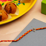 Om Silver Rakhi with Besan Ladoo