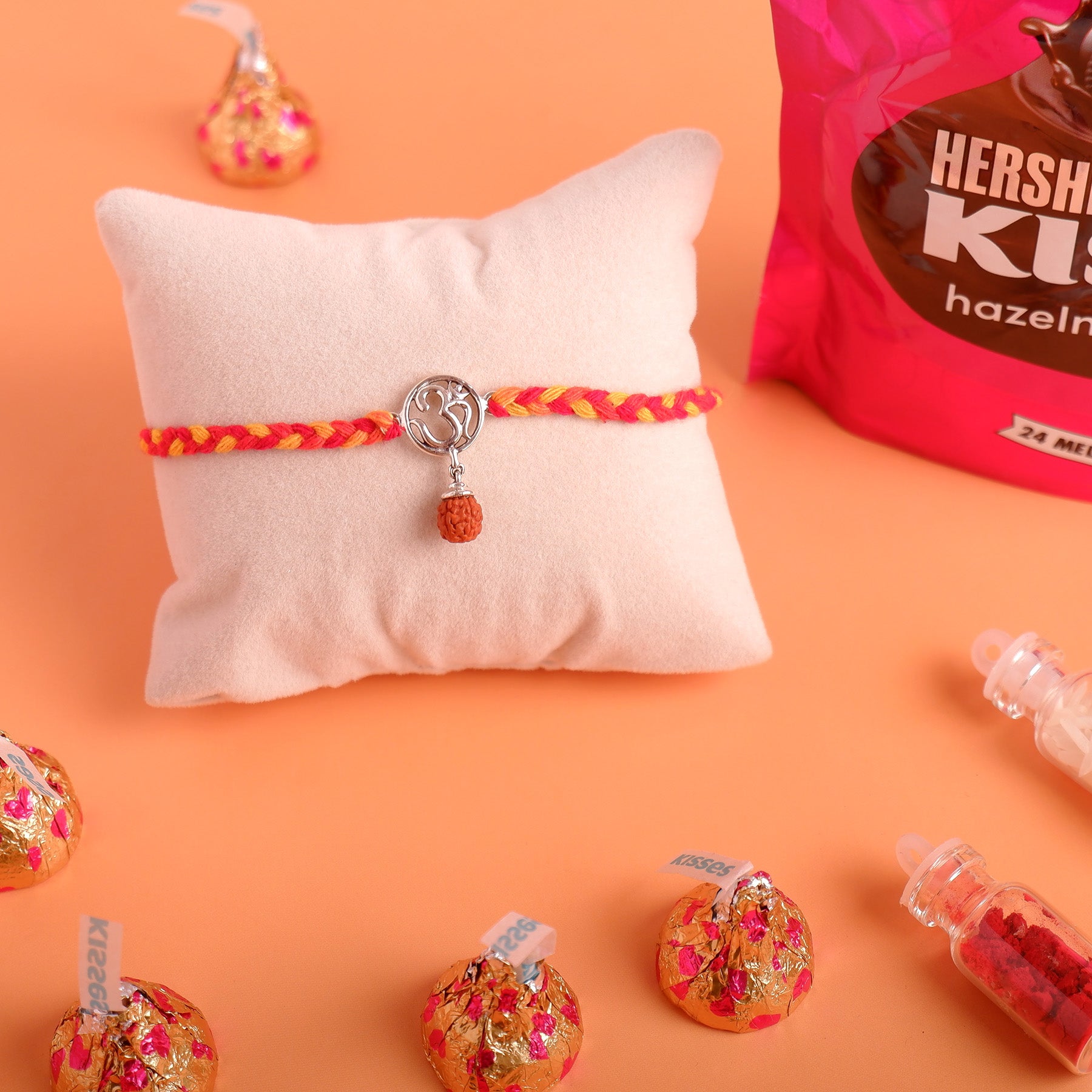 Rudraksh OM Silver Rakhi with Hersheys Kisses Hazelnut n Cookies