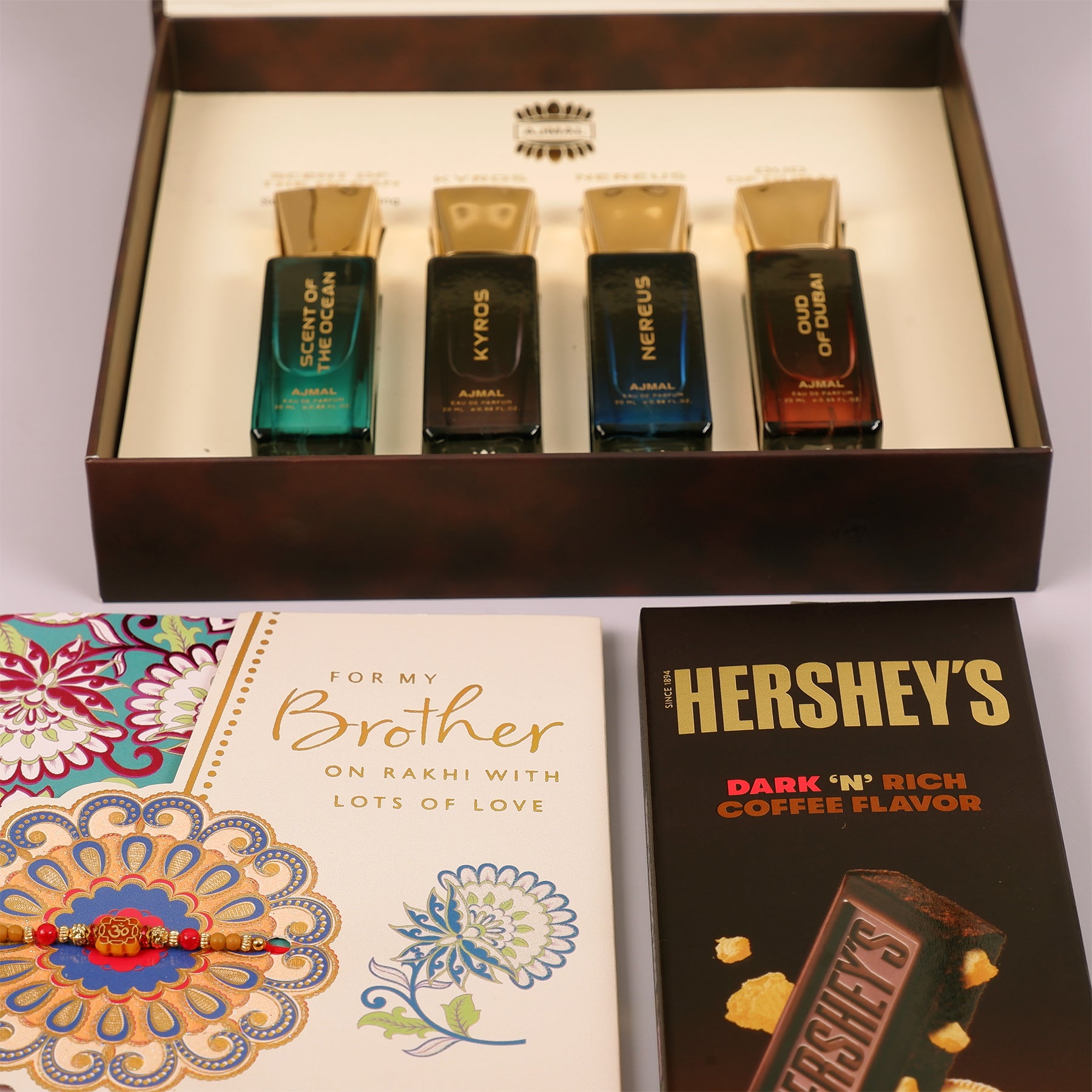 Oud Of Dubai Perfume with Rakhi Greeting Card and Hersheys Coffee Chocolate