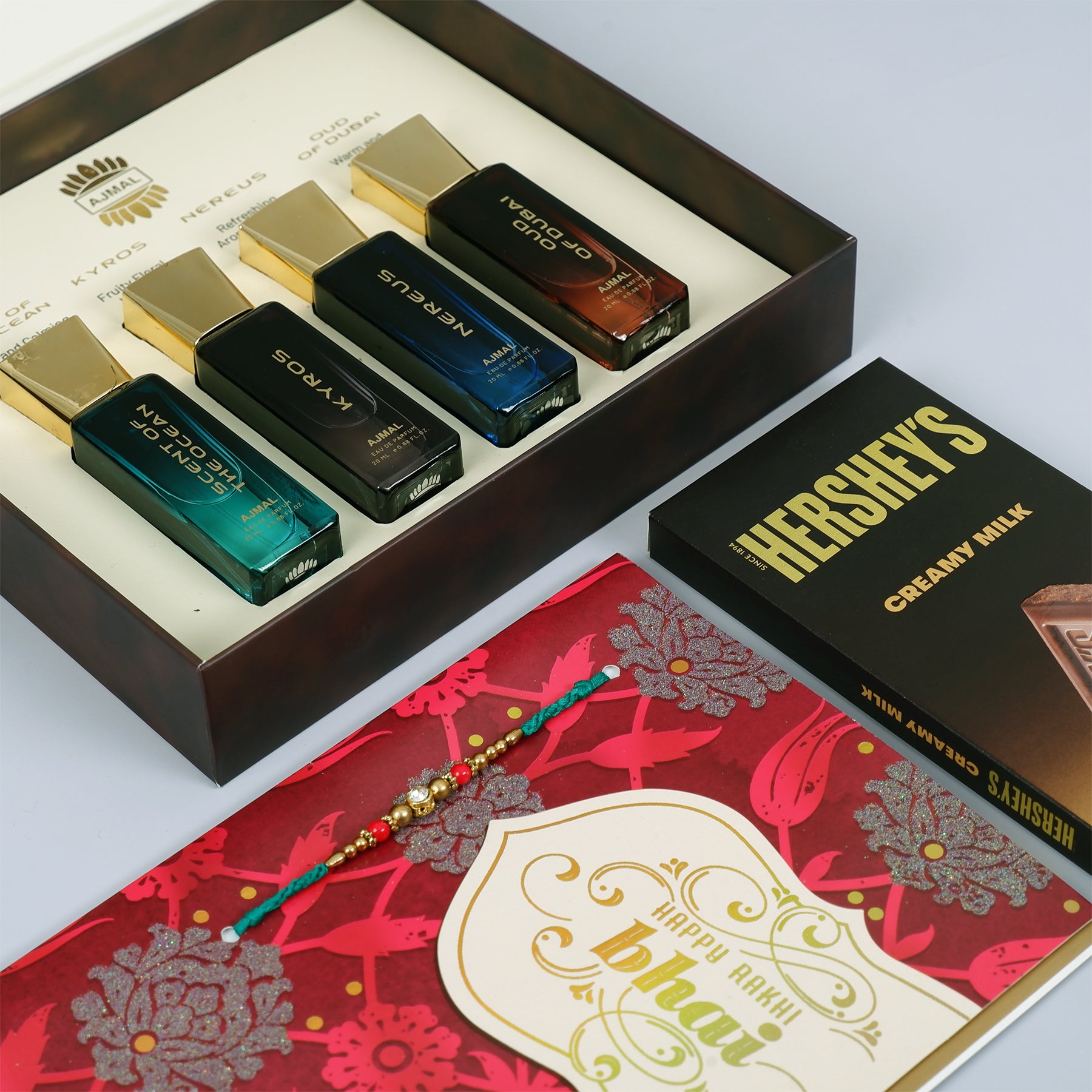 Oud Of Dubai Perfume with Rakhi Greeting Card and Hersheys Chocolate