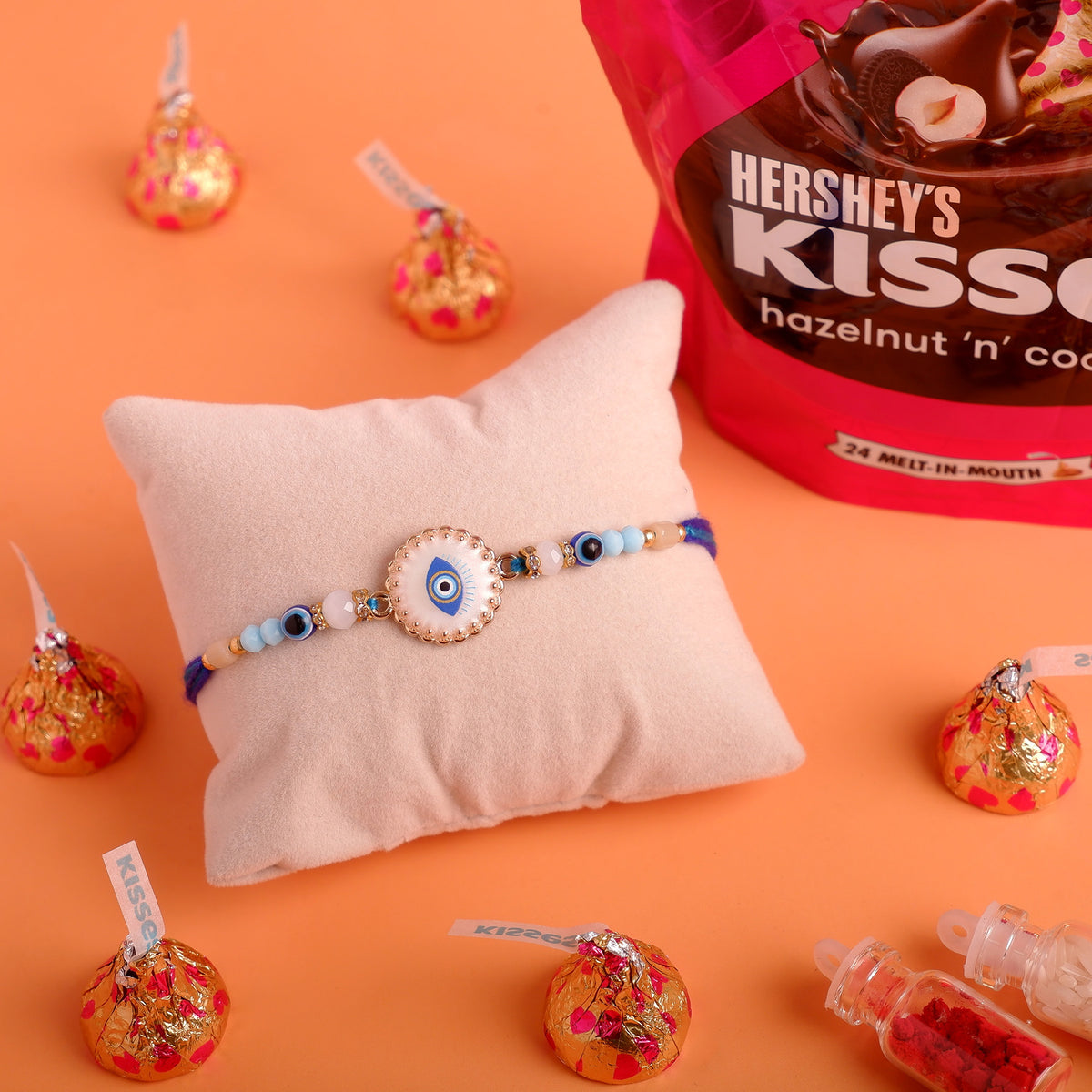 Blue Evil Eye Rakhi with Hersheys Kisses Hazelnut n Cookies