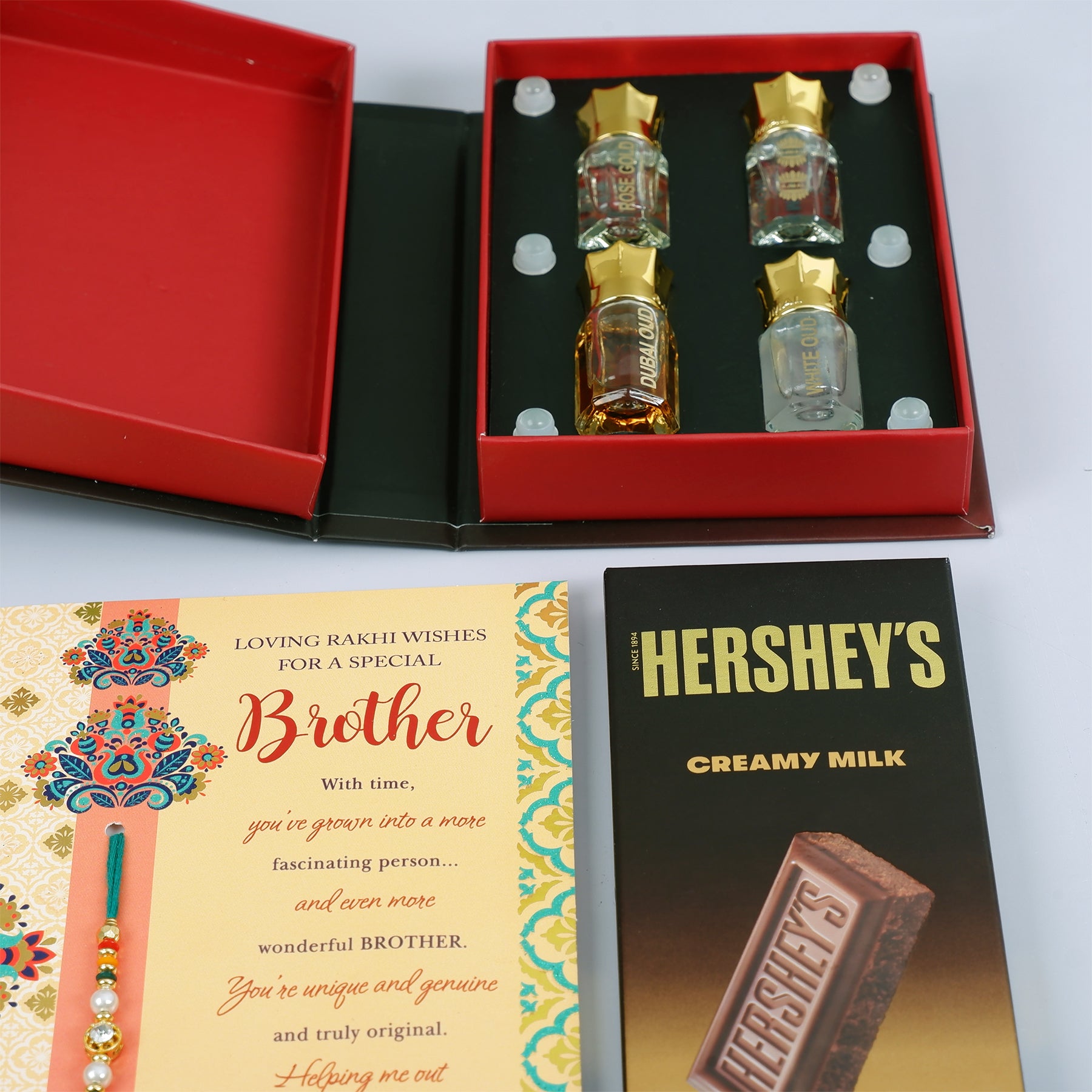 Ajmal Gold Series Perfume with Rakhi Greeting Card and Hersheys Bar