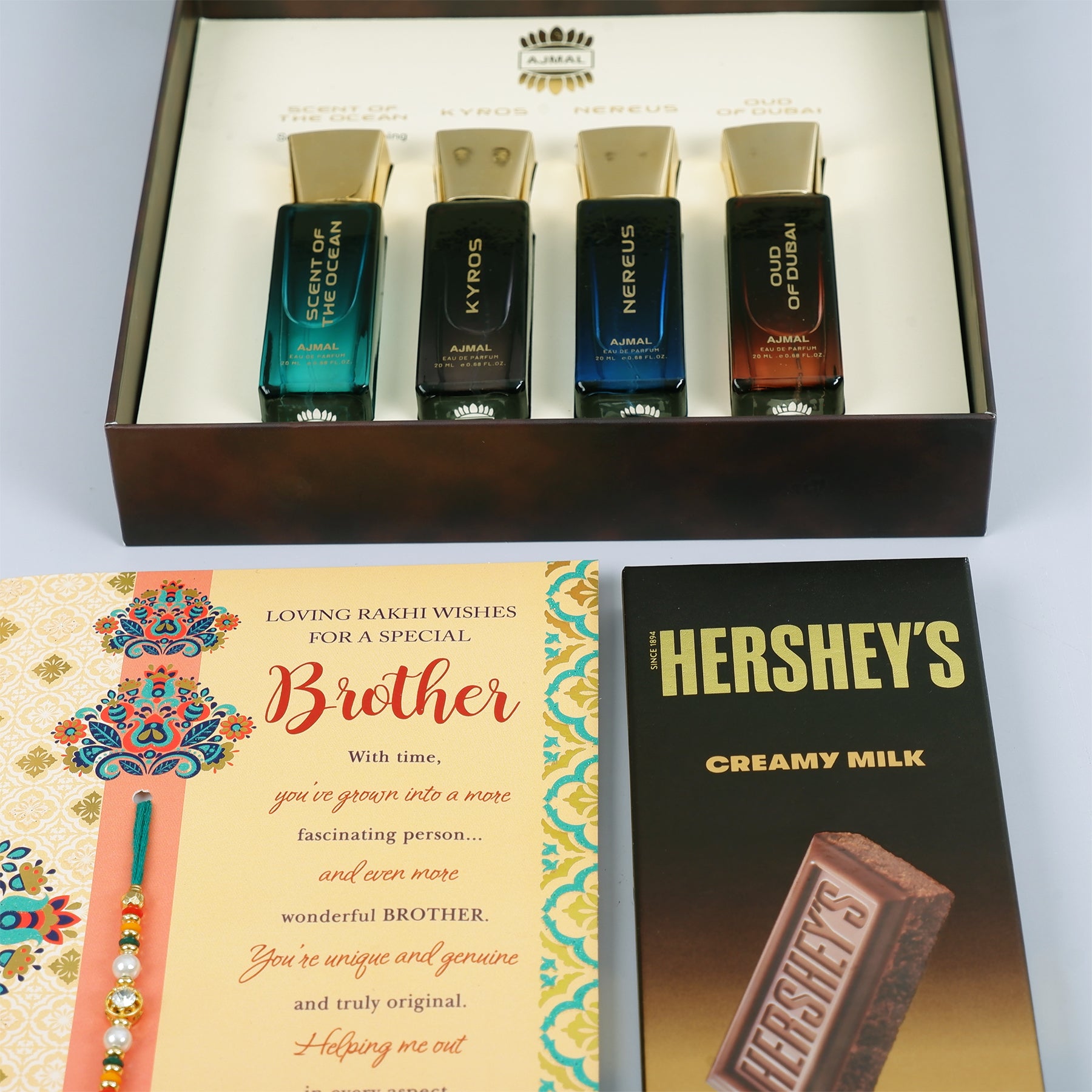 Oud Of Dubai Perfume with Rakhi Greeting Card and Hersheys Chocolate Bar
