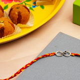 Infinite Bro Silver Rakhi with Besan Ladoo