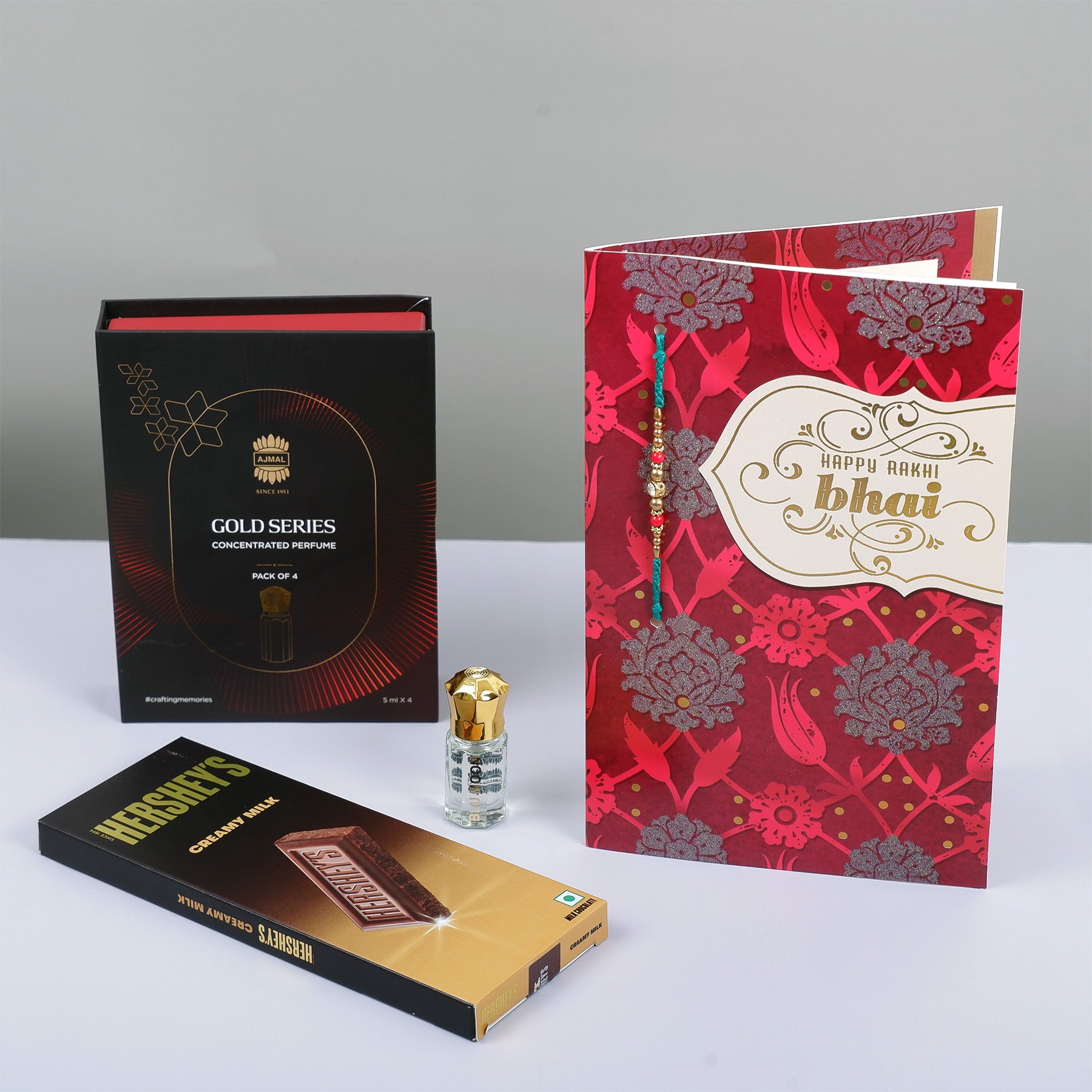 Ajmal Gold Series Perfume with Rakhi Greeting Card and Hersheys Chocolate