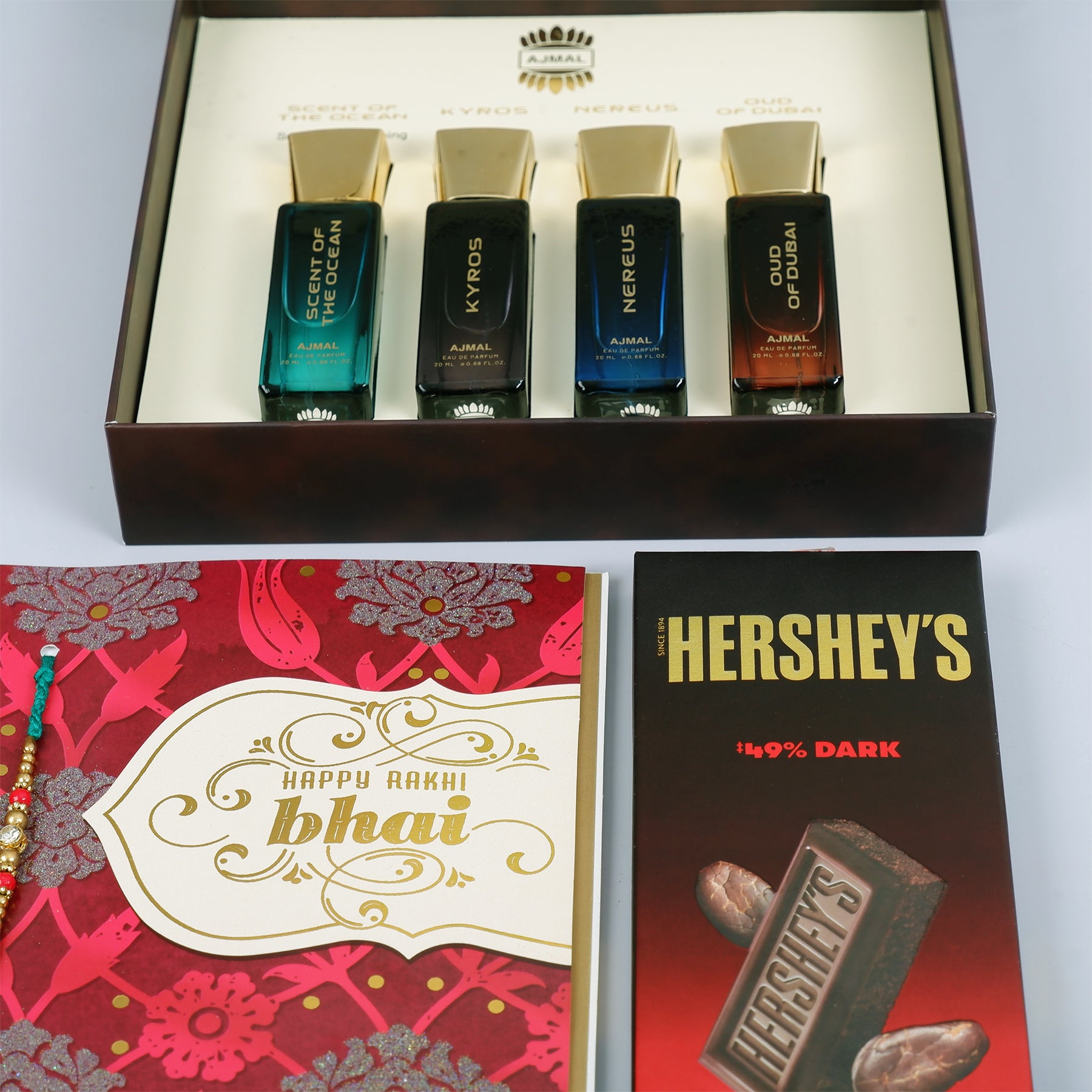 Oud Of Dubai Perfume with Rakhi Greeting Card and Hersheys Dark Chocolate Bar