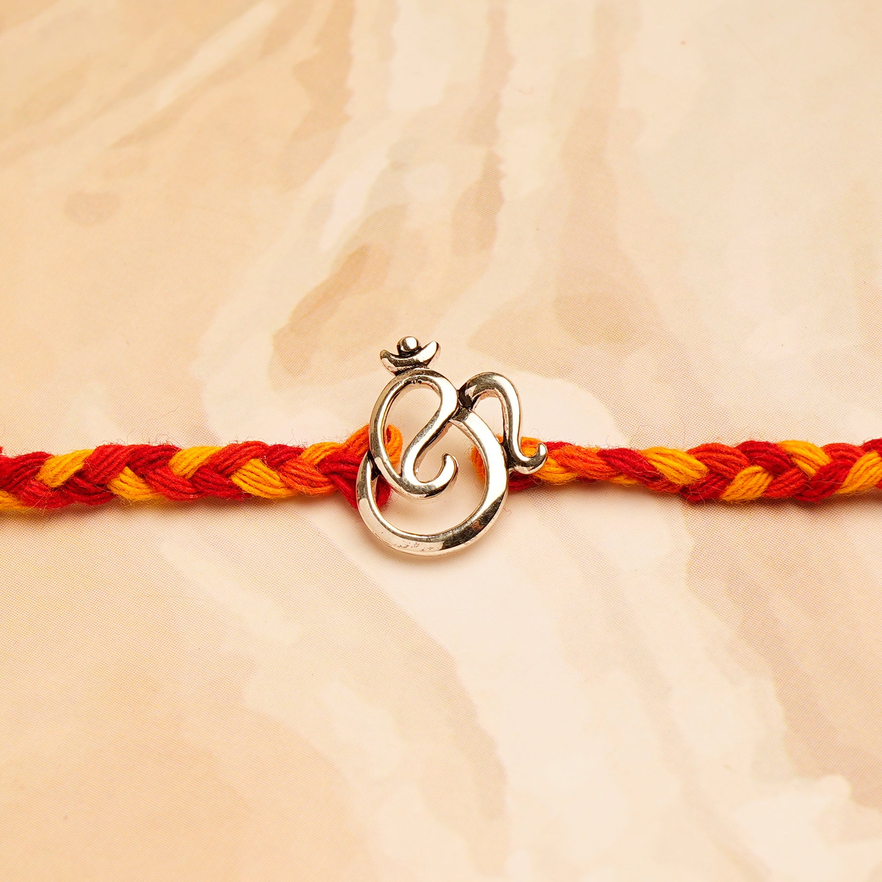 OM Ganesha Premium Silver Rakhi