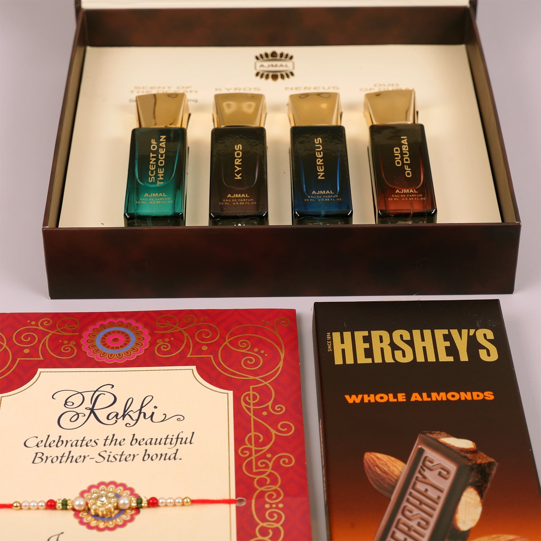 Oud Of Dubai Perfume with Rakhi Greeting Card and Hersheys Almond Bar