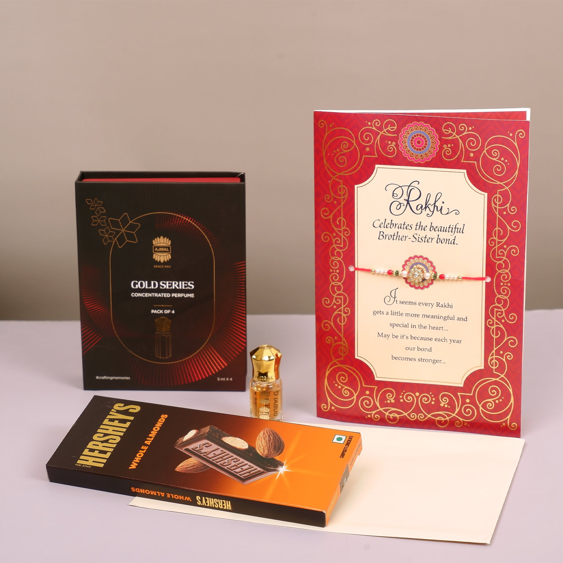 Ajmal Gold Series Perfume with Rakhi Greeting Card and Hersheys Almond Bar