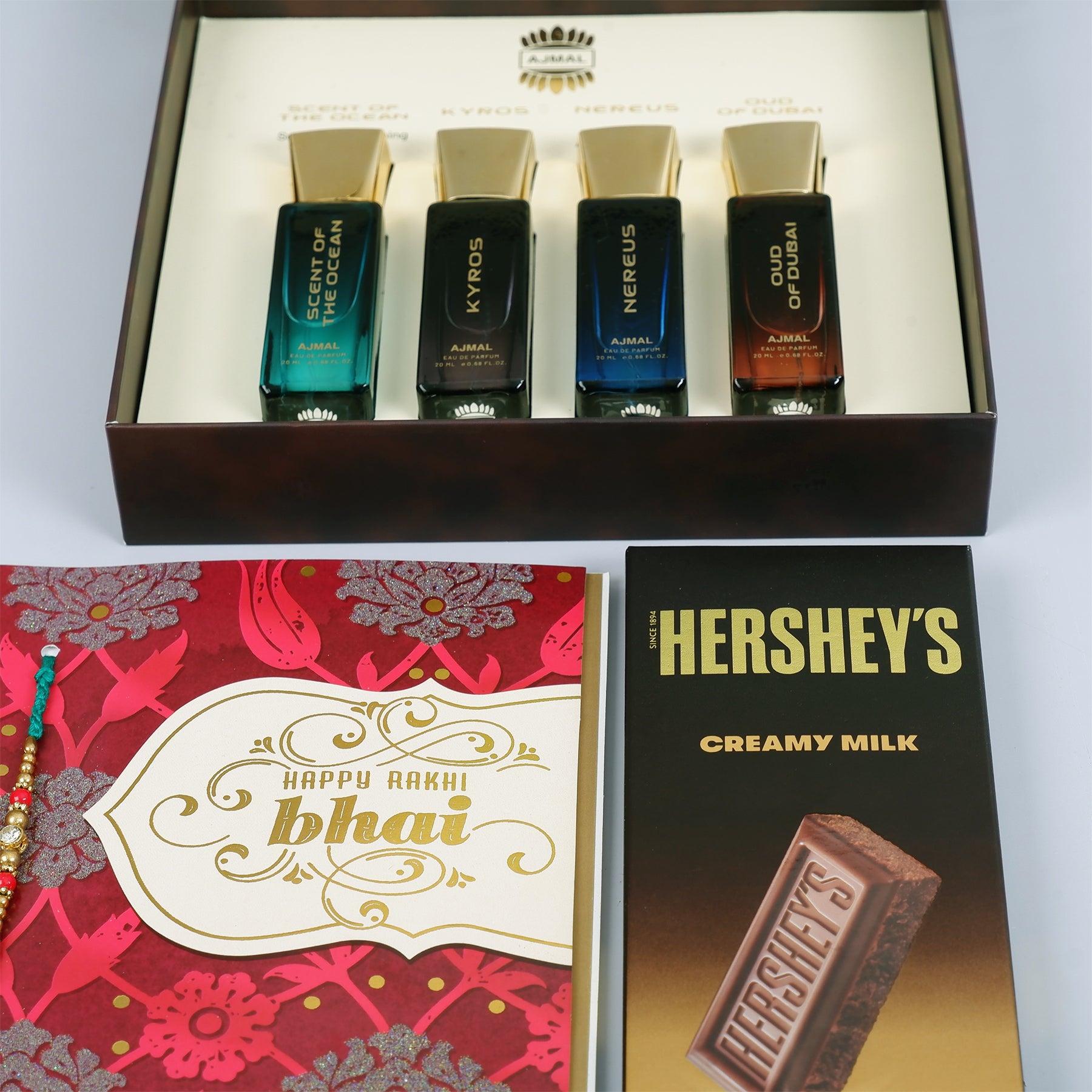 Oud Of Dubai Perfume with Rakhi Greeting Card and Hersheys Chocolate