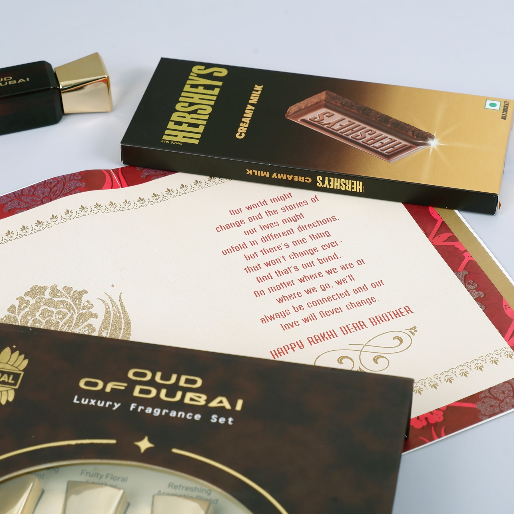 Oud Of Dubai Perfume with Rakhi Greeting Card and Hersheys Chocolate