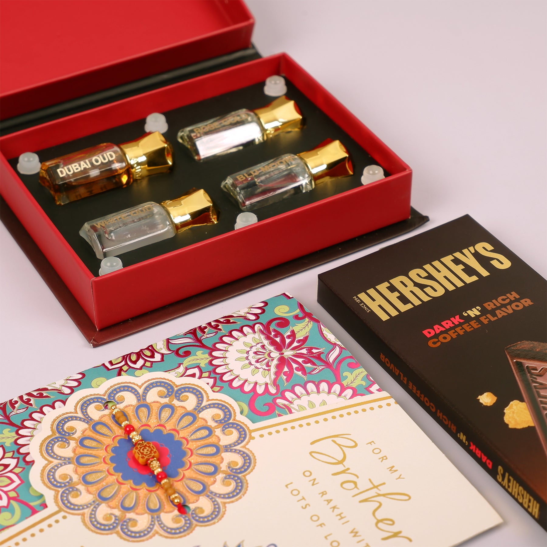 Ajmal Gold Series Perfume with Rakhi Greeting Card and Hersheys Coffee Chocolate