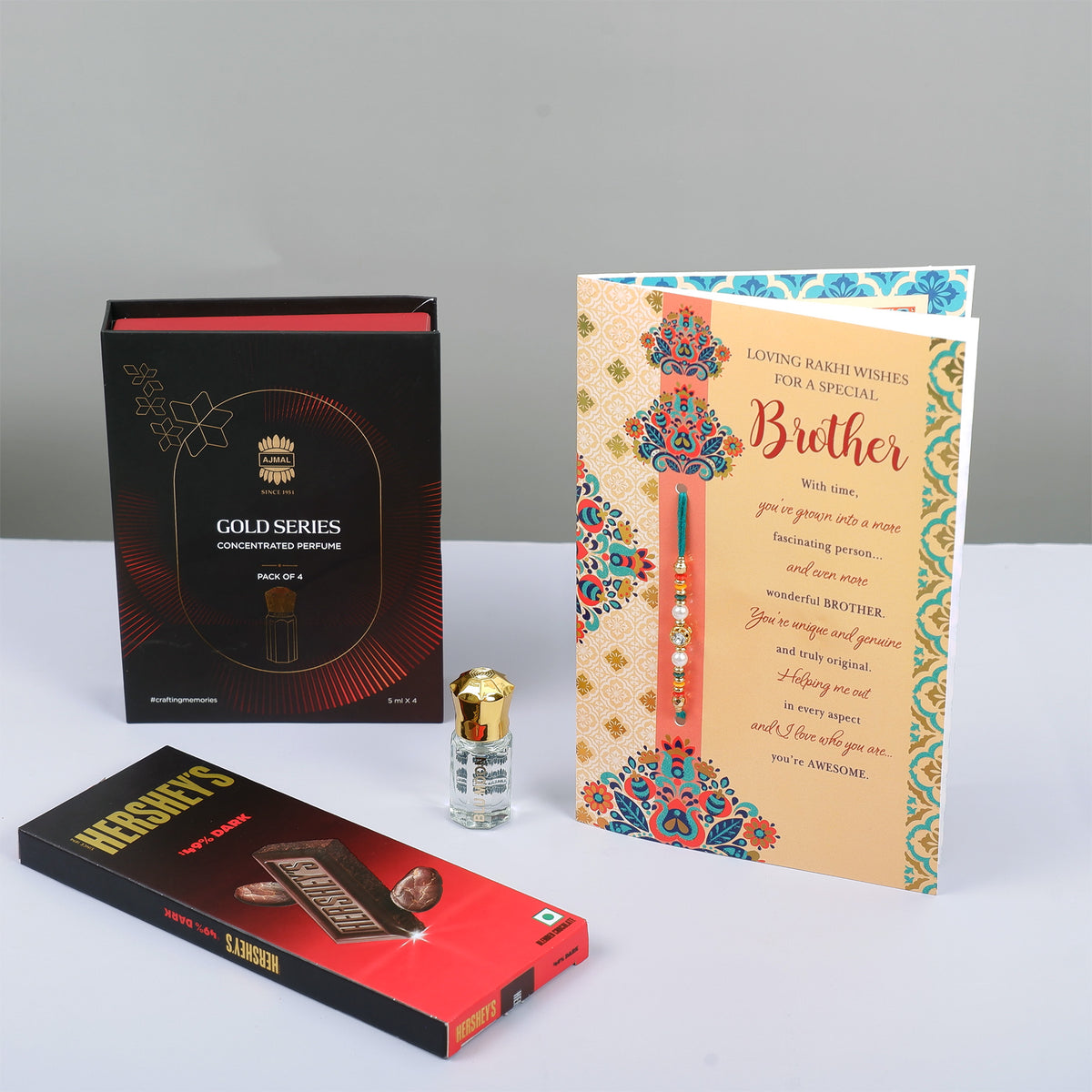 Ajmal Gold Series Perfume with Rakhi Greeting Card and Hersheys Dark Chocolate