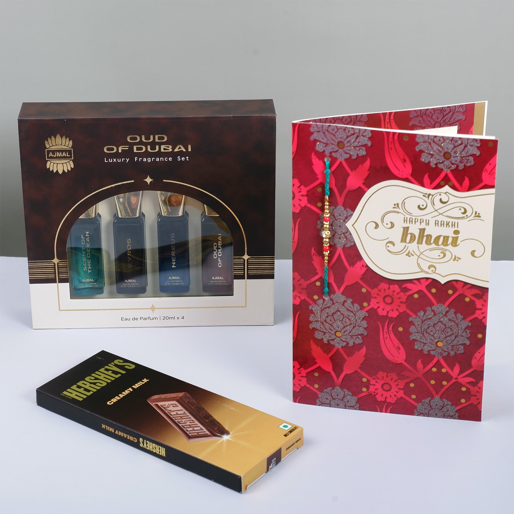 Oud Of Dubai Perfume with Rakhi Greeting Card and Hersheys Chocolate