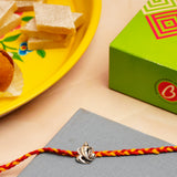 OM Ganesha Silver Rakhi with Kaju Barfi