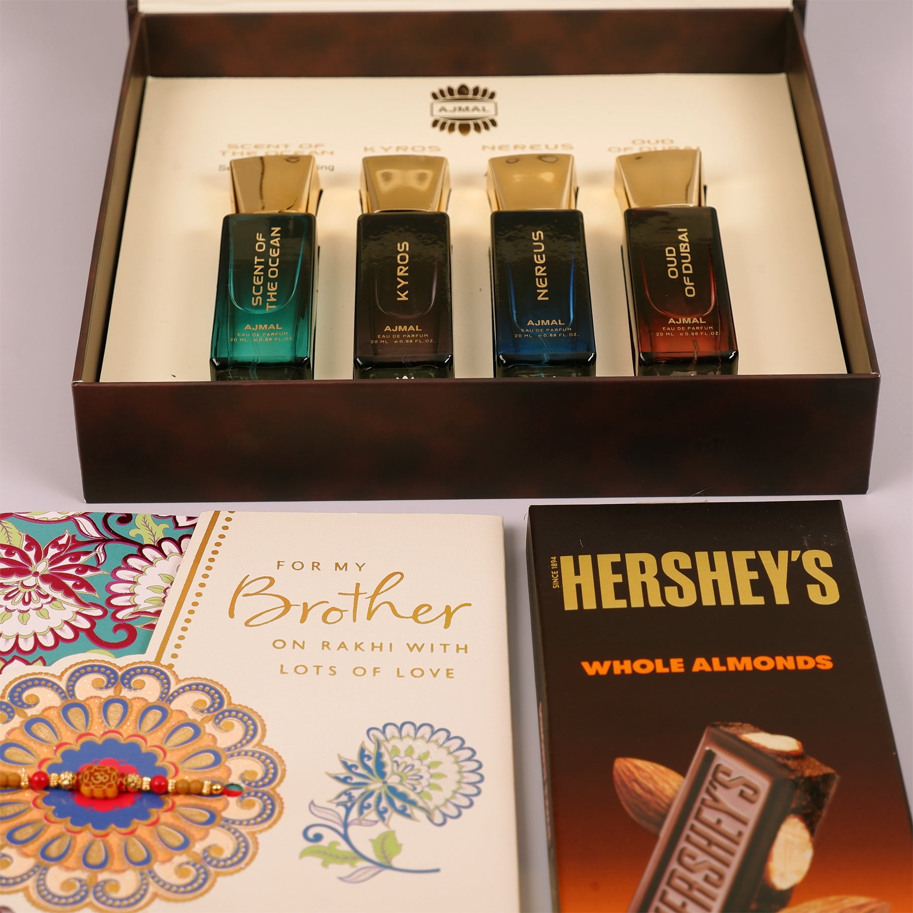 Oud Of Dubai Perfume with Rakhi Greeting Card and Hersheys Bar