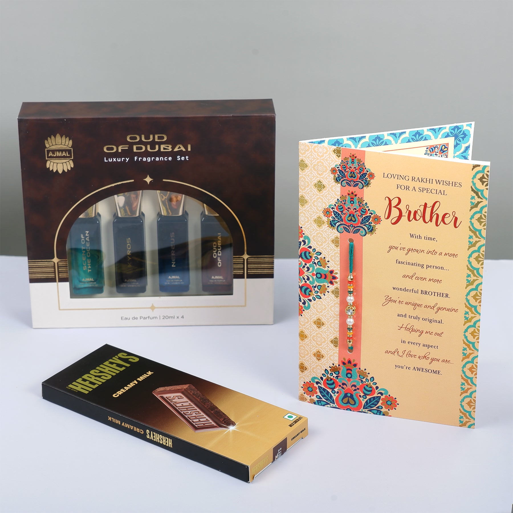 Oud Of Dubai Perfume with Rakhi Greeting Card and Hersheys Chocolate Bar