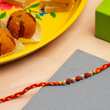 Rudraksh Silver Rakhi with Besan Ladoo