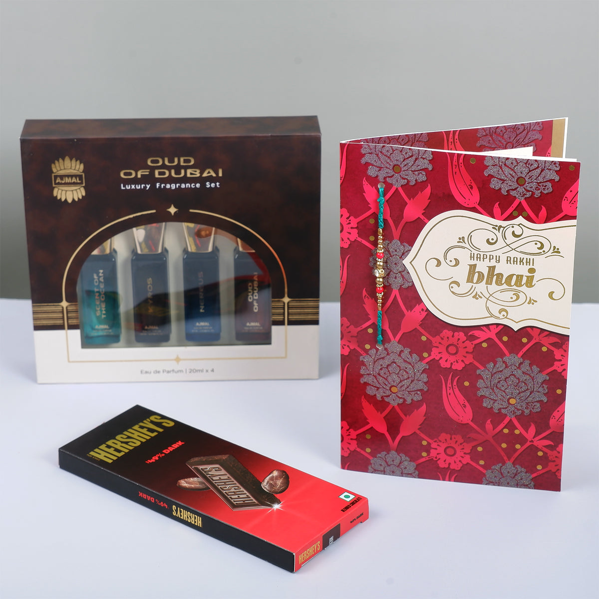 Oud Of Dubai Perfume with Rakhi Greeting Card and Hersheys Dark Chocolate Bar