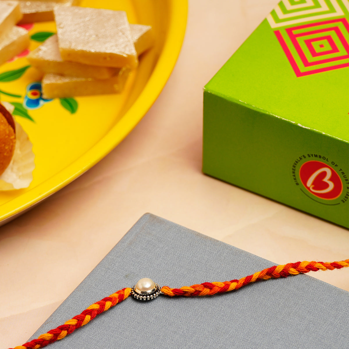 Pearl Silver Rakhi with Kaju Barfi