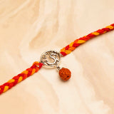 Rudraksh OM Silver Rakhi with Hersheys Kisses Hazelnut n Cookies