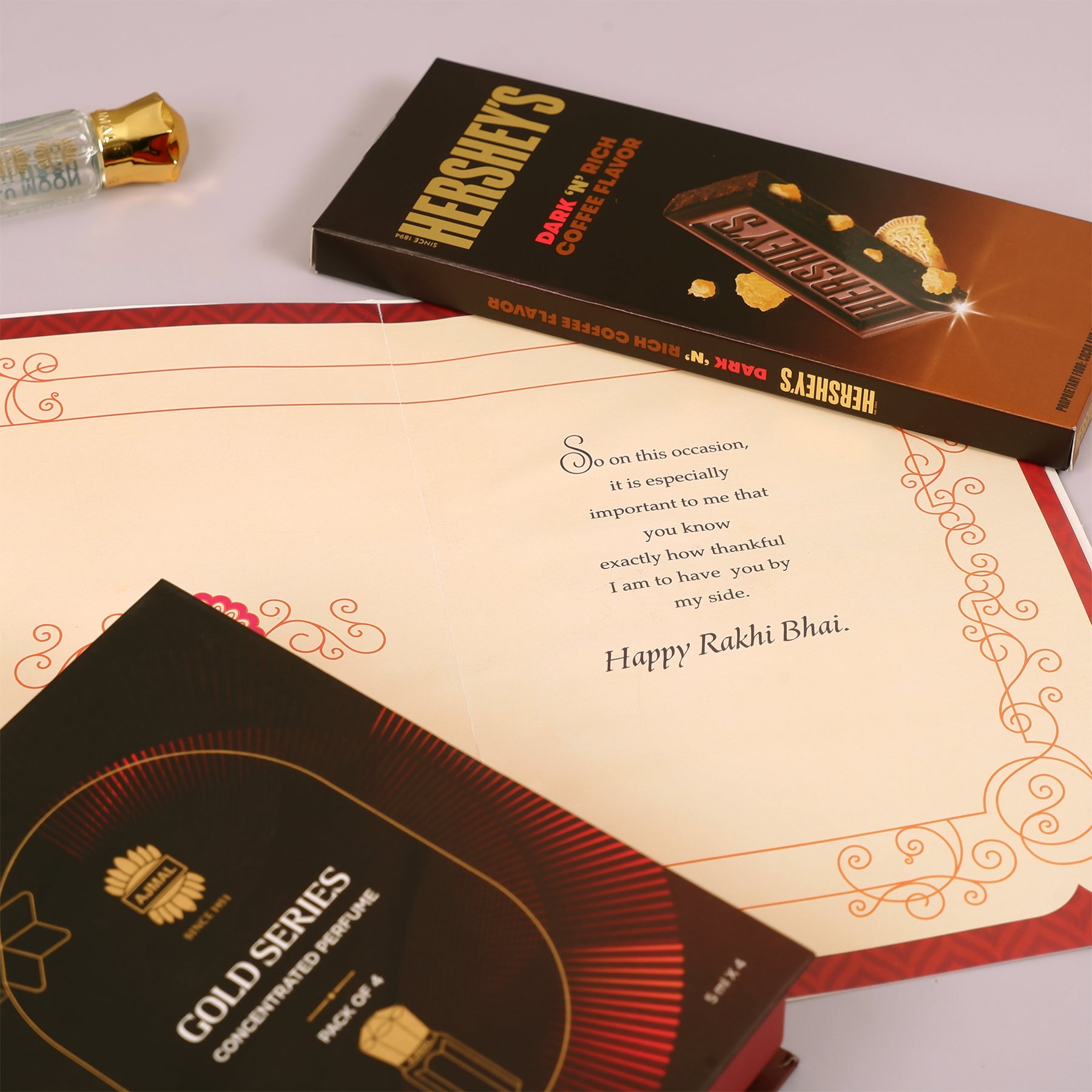 Ajmal Gold Series Perfume with Rakhi Greeting Card and Hersheys Coffee Bar