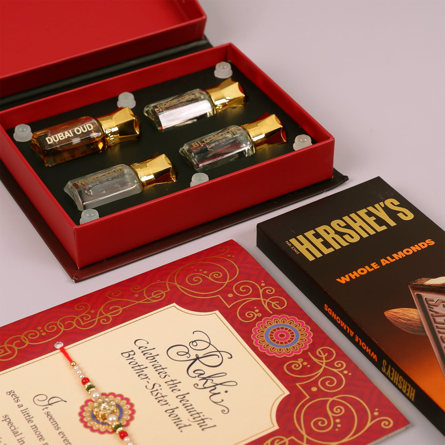 Ajmal Gold Series Perfume with Rakhi Greeting Card and Hersheys Almond Bar