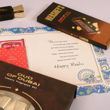 Oud Of Dubai Perfume with Rakhi Greeting Card and Hersheys Coffee Chocolate