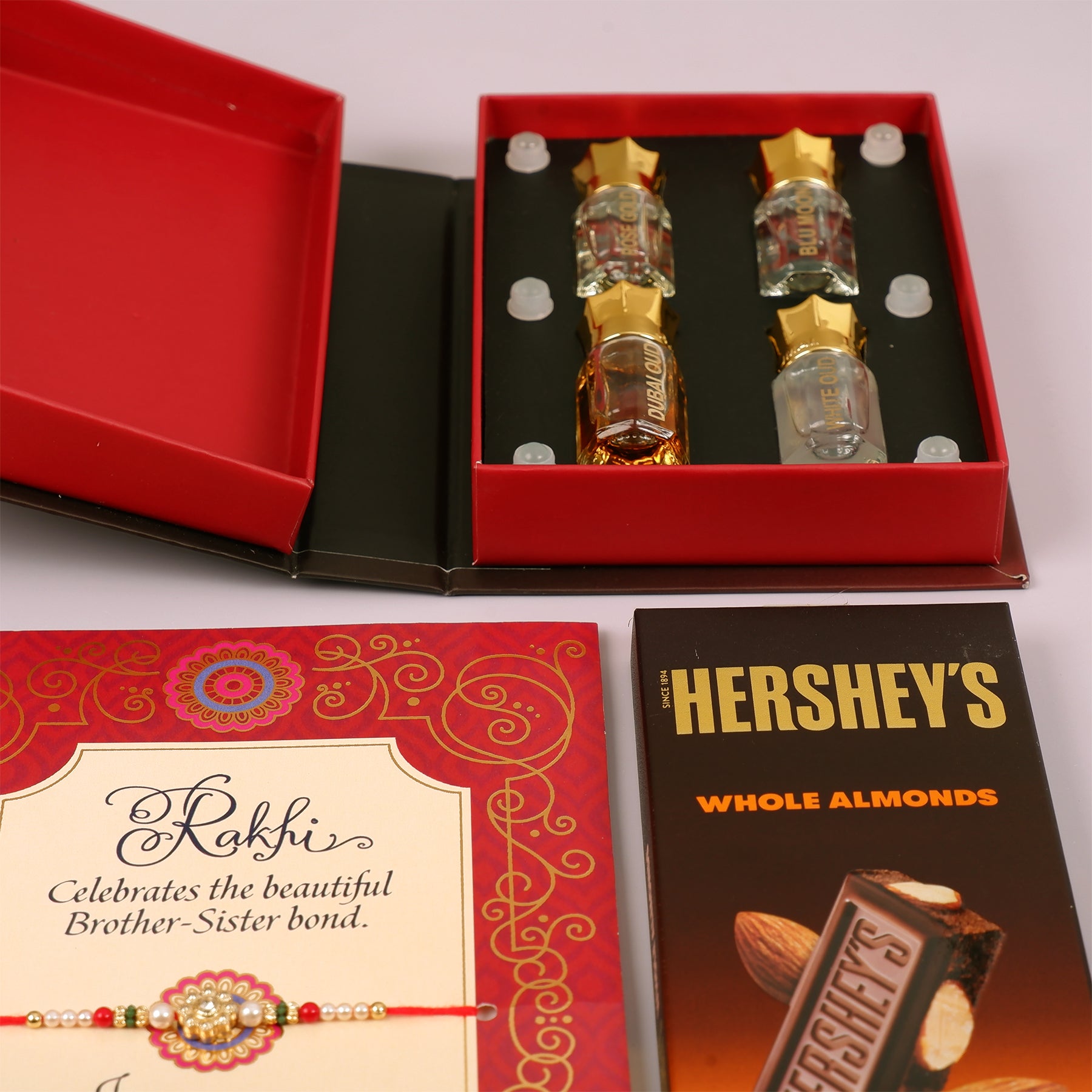 Ajmal Gold Series Perfume with Rakhi Greeting Card and Hersheys Almond Bar