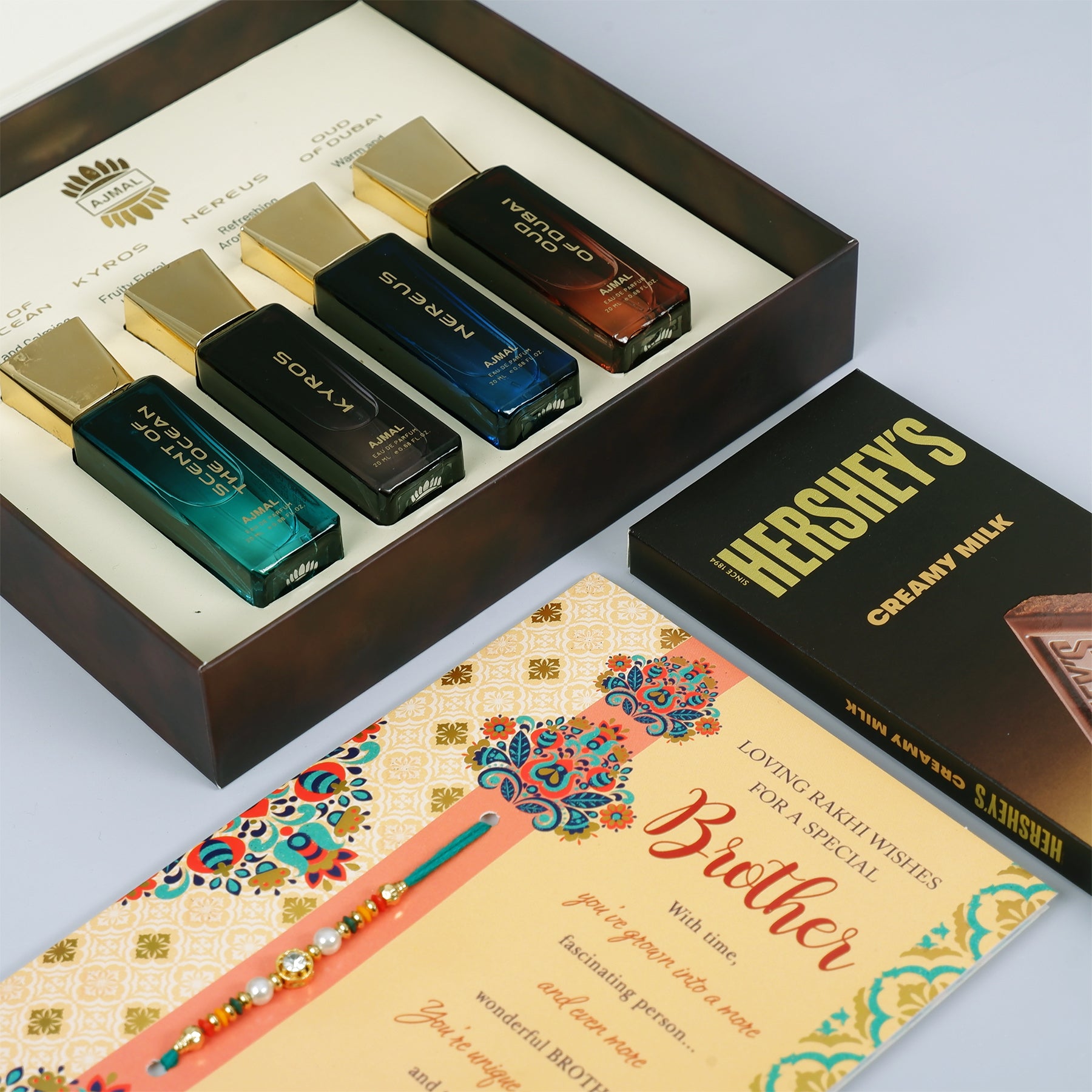 Oud Of Dubai Perfume with Rakhi Greeting Card and Hersheys Chocolate Bar