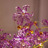 Purple Blossoms in Crystal Vase