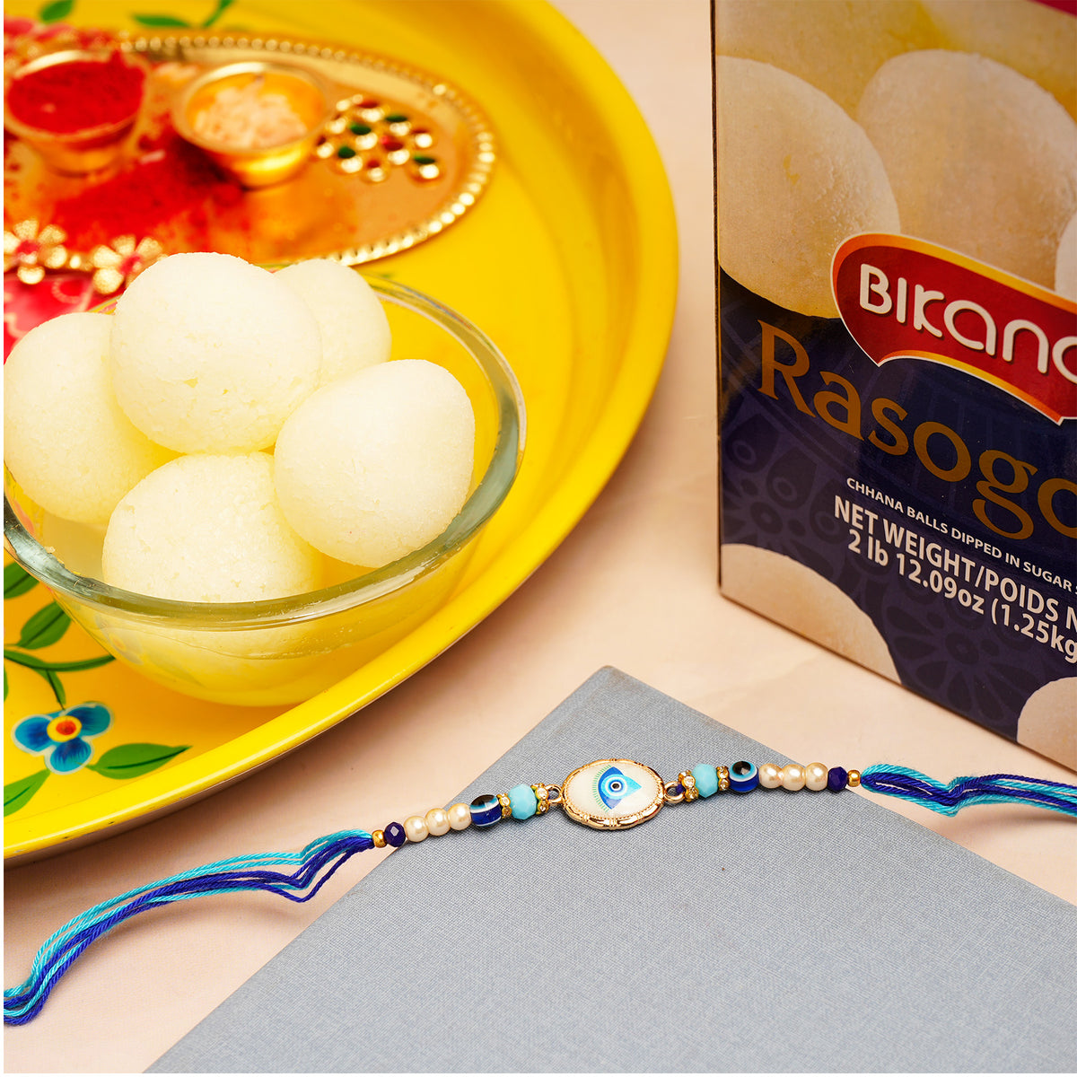 Protective Rakhi with Rasgulla